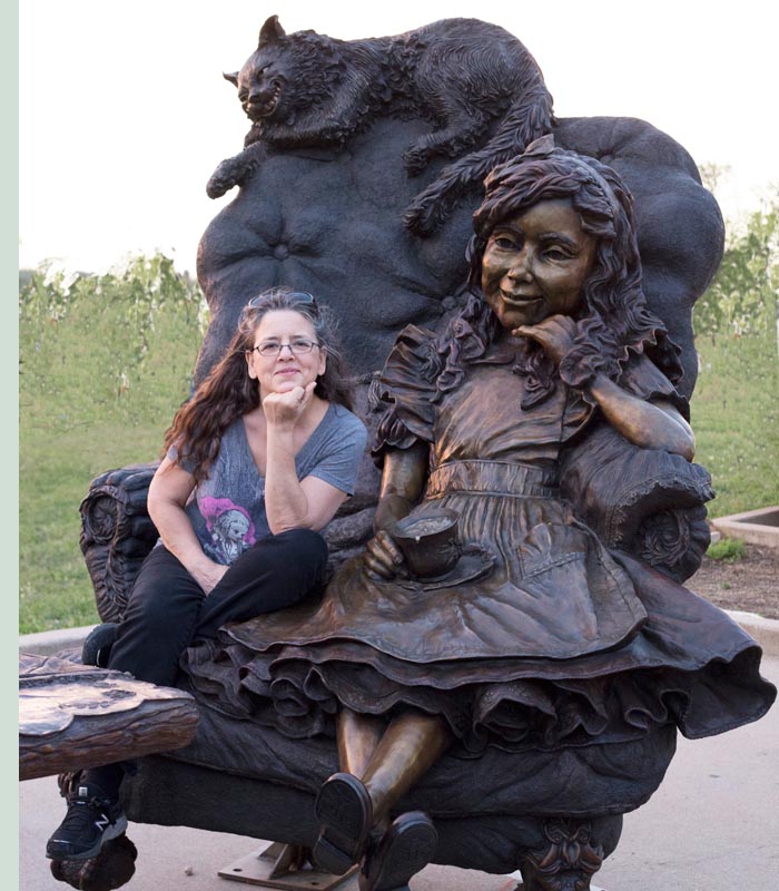 alice_j Bridgette Mongeon Sits in the bronze chair with Alice in Wonderland In Texas
