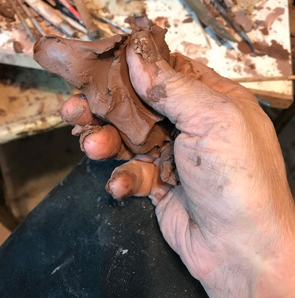 clayinhand Artist Bridgette with clay in her fingers.