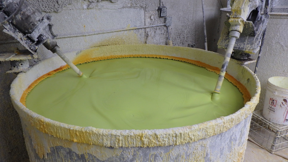 getting ready to dip in the vat. Part of the bronze process.