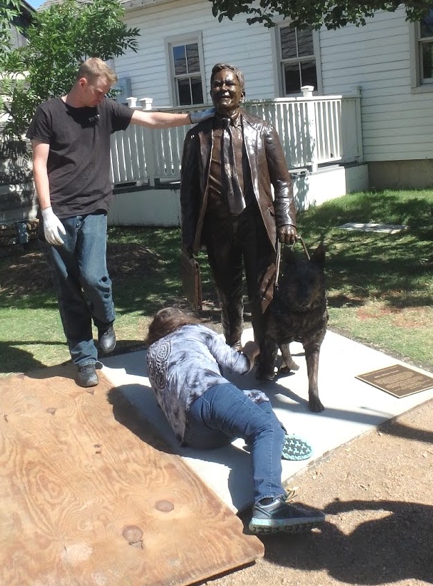 johnturner34 Installing a bronze sculpture of a man and dog. Texas artist Bridgette Mongeon.