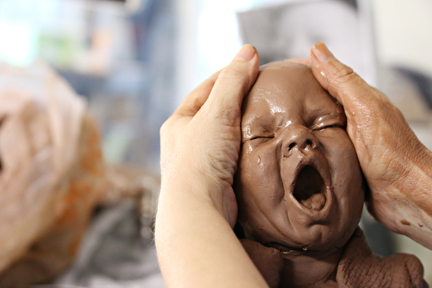 sculptingfaces Texas, artist sculpts baby