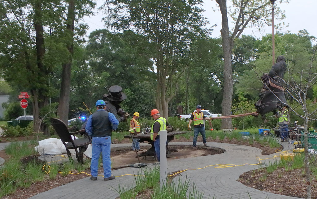 Sculptor Bridgette Mongeon directs the installers in creating Wonderland