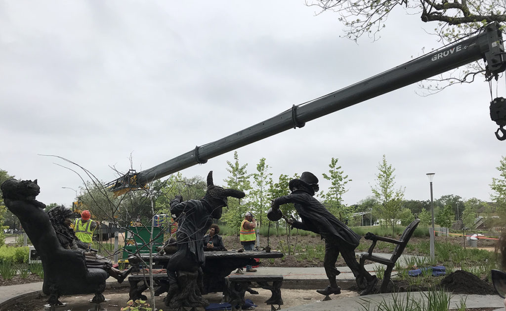 Bronze sculpture installation of Alice In wonderland's Mad Hatter Tea party.